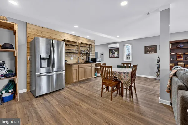 a kitchen with stainless steel appliances granite countertop a sink and cabinets