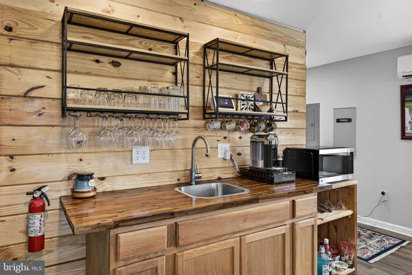 a kitchen with stainless steel appliances a sink and cabinets