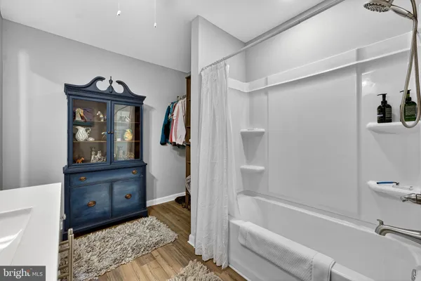 a bathroom with a sink a vanity and a mirror