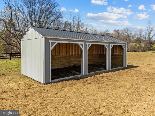 a view of a swimming pool with an outdoor seating