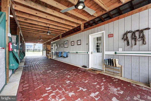 a view of a porch with wooden walls