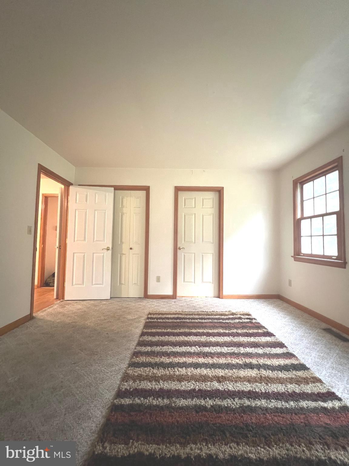 30883 Ward Road Salisbury, MD 21804 - Photo 11 of 34 a view of a bedroom with a balcony and large window