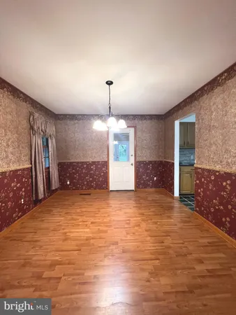 a view of a kitchen with a sink and a large window