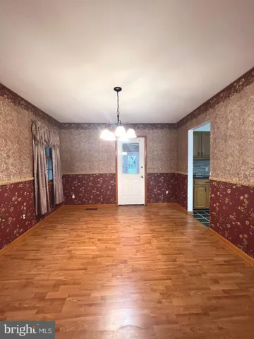 a view of a kitchen with a sink and a large window