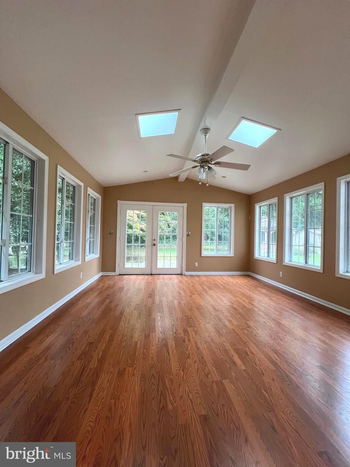 30883 Ward Road Salisbury, MD 21804 - Photo 22 of 34 a view of an empty room with wooden floor and a window