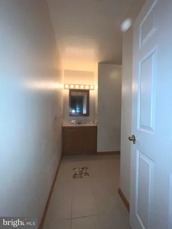 a bathroom with a sink a mirror and a toilet