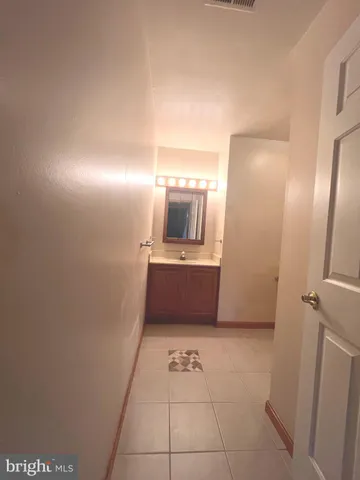 a bathroom with a toilet a sink and bathtub