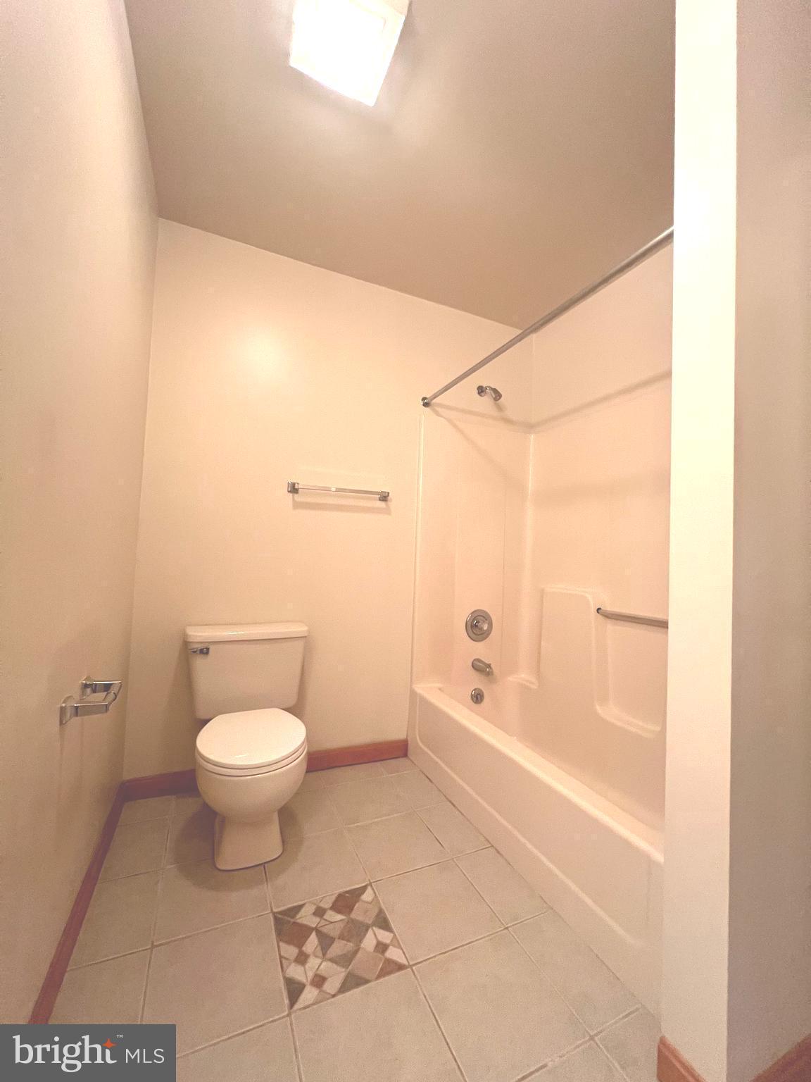 30883 Ward Road Salisbury, MD 21804 - Photo 29 of 34 a bathroom with a toilet a sink and bathtub