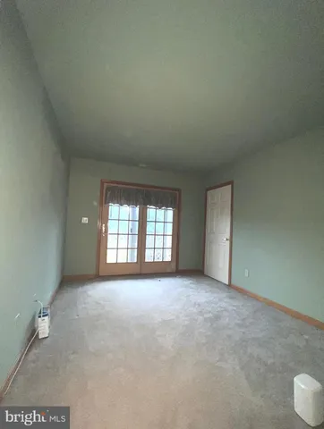 a view of empty room with windows