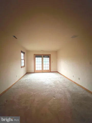 a bathroom with a toilet tub and shower