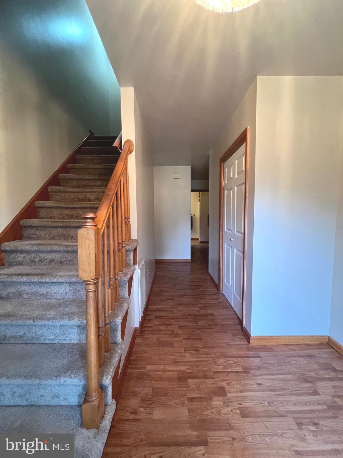 30883 Ward Road Salisbury, MD 21804 - Photo 6 of 34 a view of a hallway with wooden floor and staircase