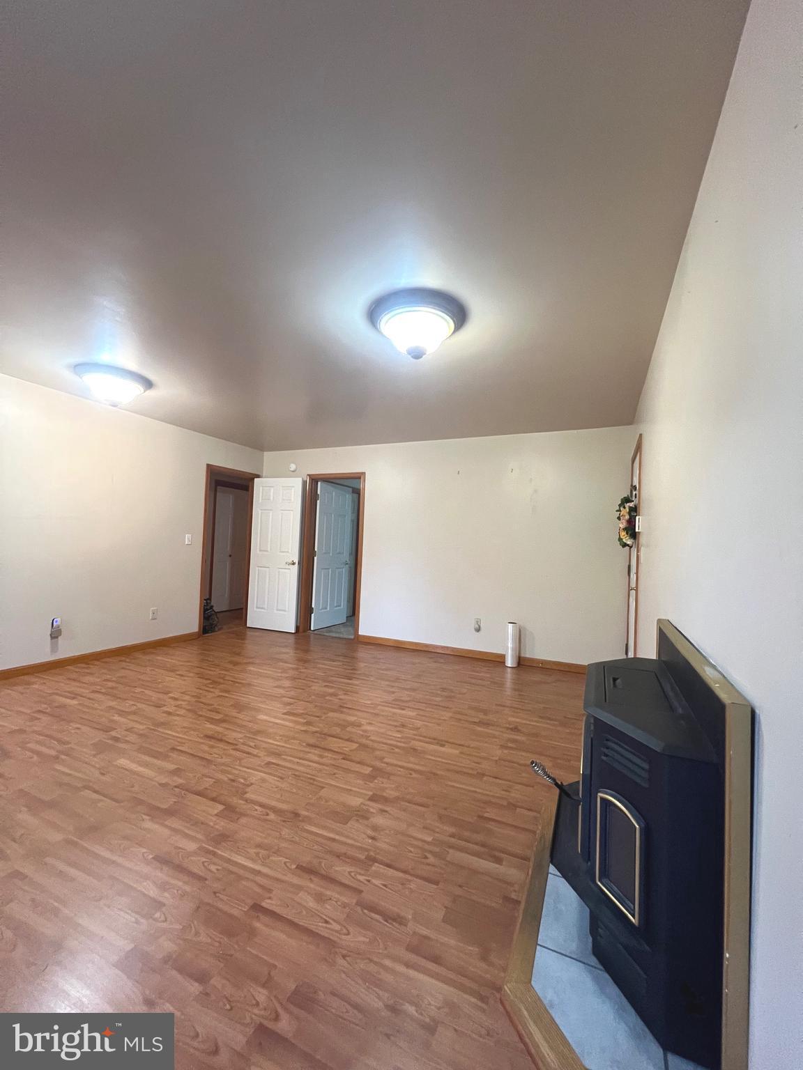 30883 Ward Road Salisbury, MD 21804 - Photo 9 of 34 a view of an empty room with wooden floor