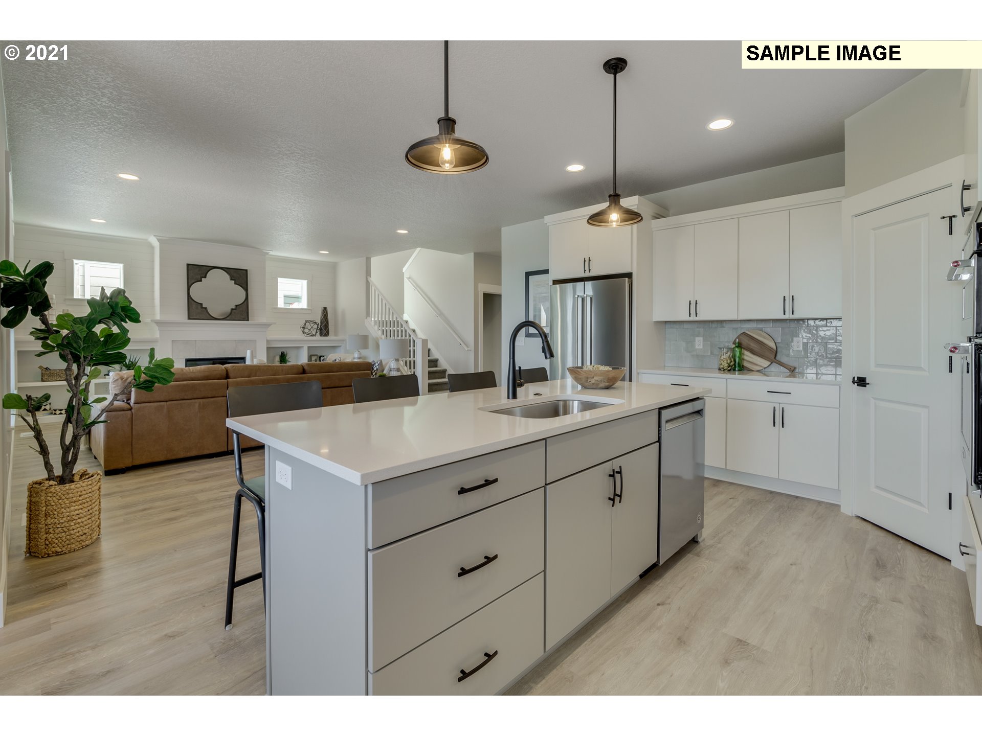17622 Southwest Sunview Lane Beaverton, OR 97007 - Photo 12 of 29 a kitchen with a sink stainless steel appliances and cabinets