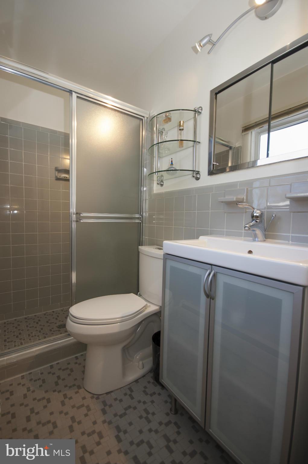 14612 Sturtevant Road Silver Spring, MD 20905 - Photo 11 of 22 a bathroom with a toilet sink and shower