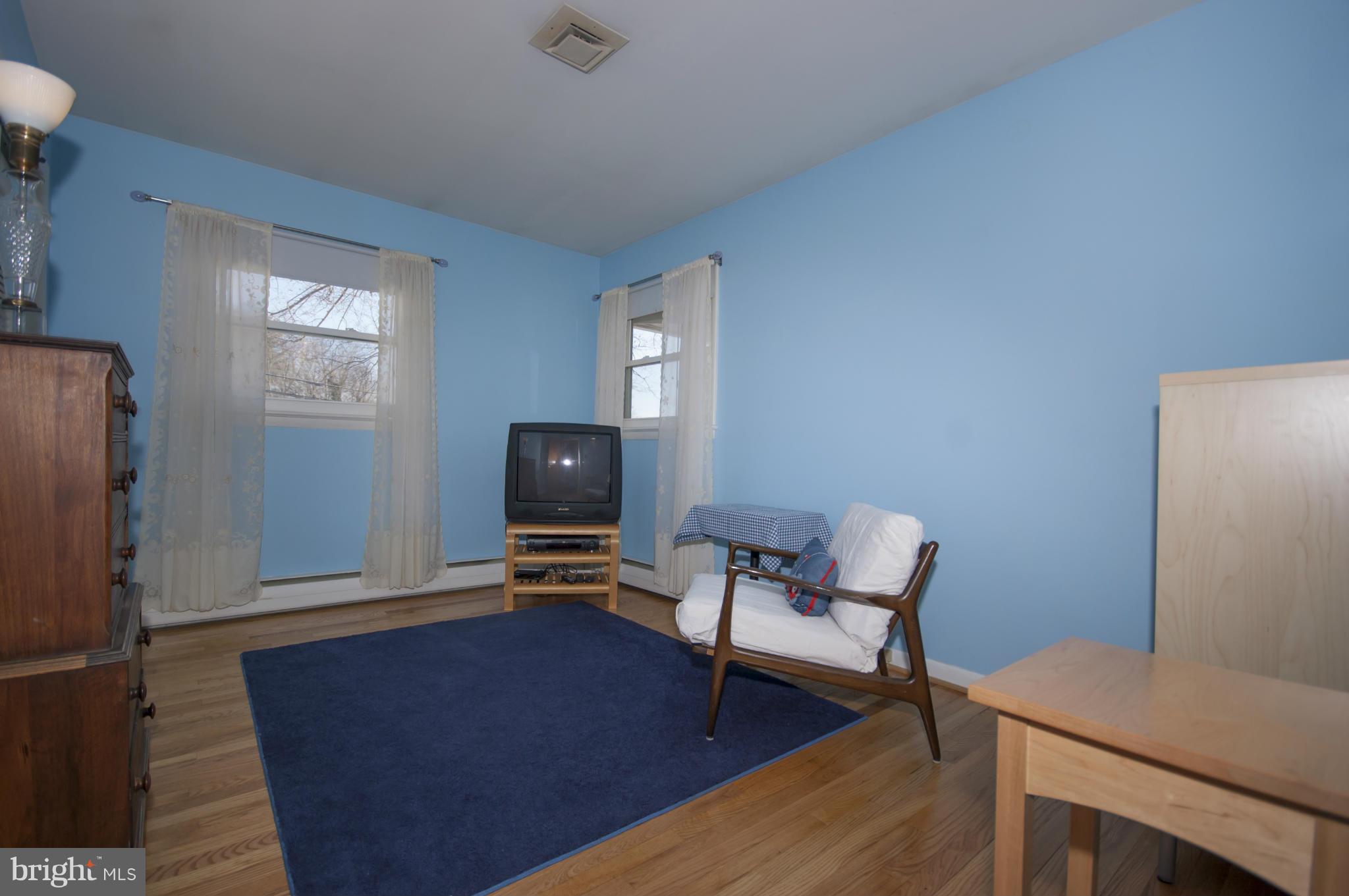 14612 Sturtevant Road Silver Spring, MD 20905 - Photo 14 of 22 a living room with furniture and a flat screen tv