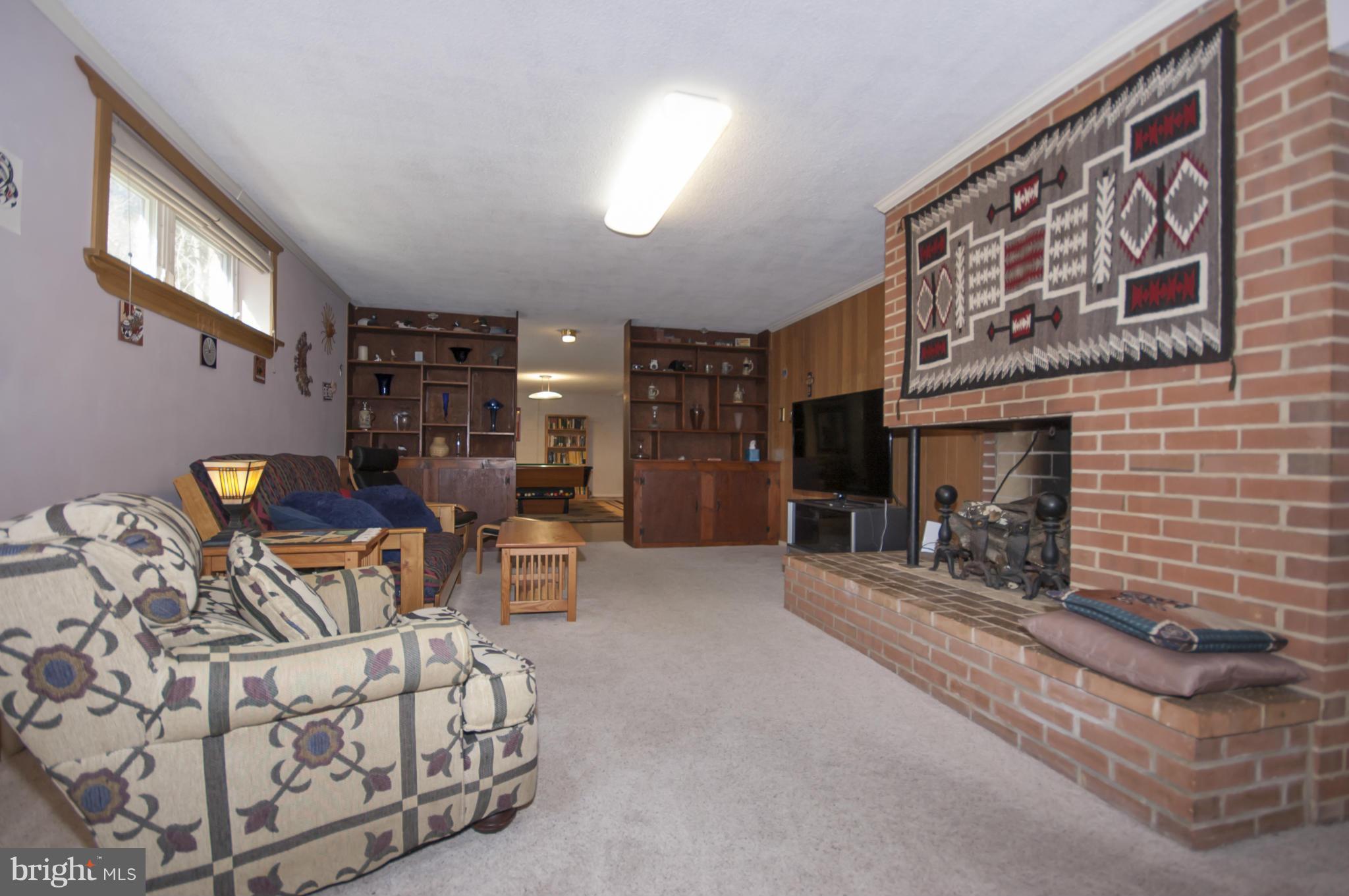 14612 Sturtevant Road Silver Spring, MD 20905 - Photo 15 of 22 a living room with furniture and a fireplace