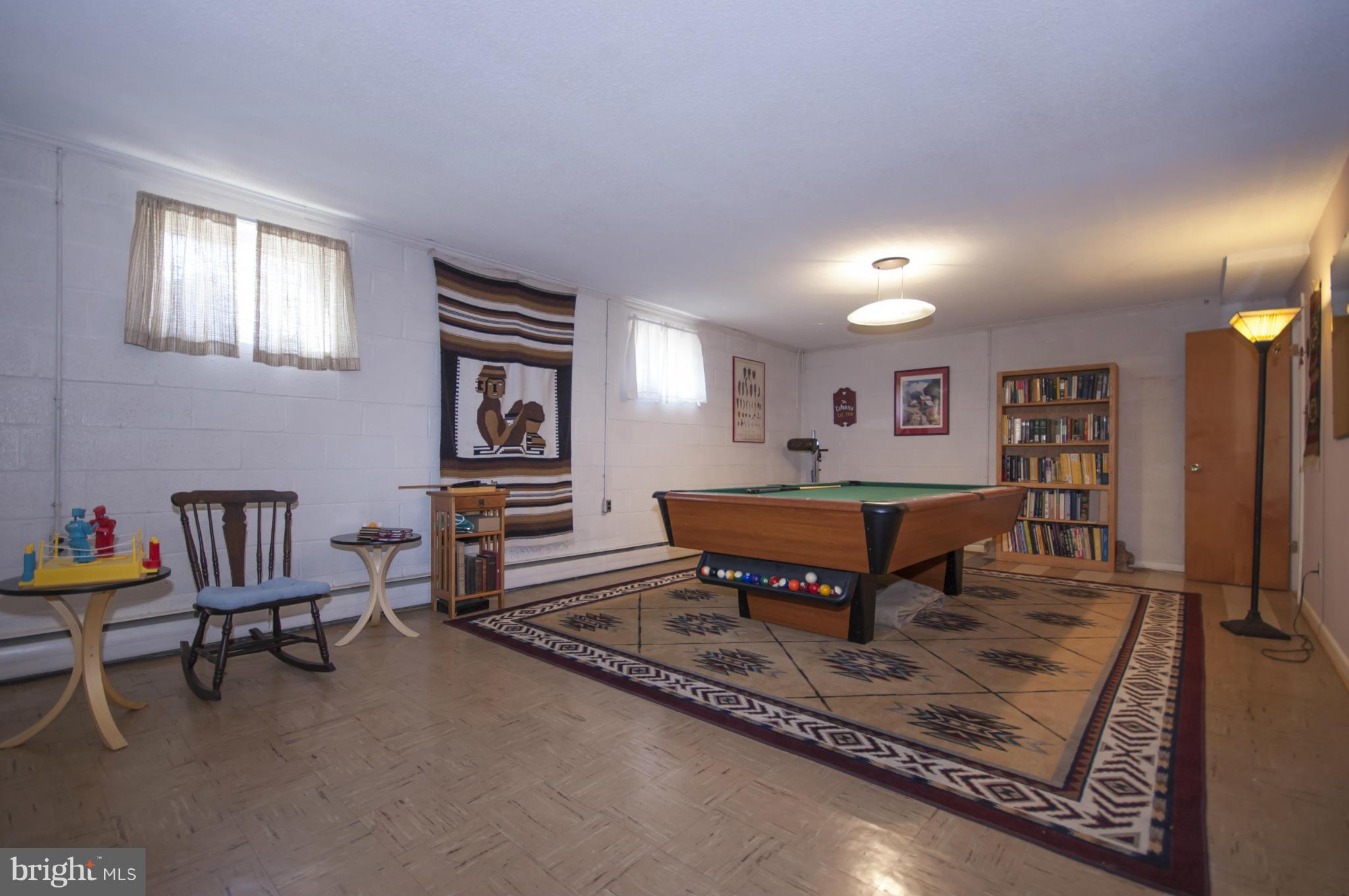14612 Sturtevant Road Silver Spring, MD 20905 - Photo 17 of 22 a living room with furniture a rug and a window