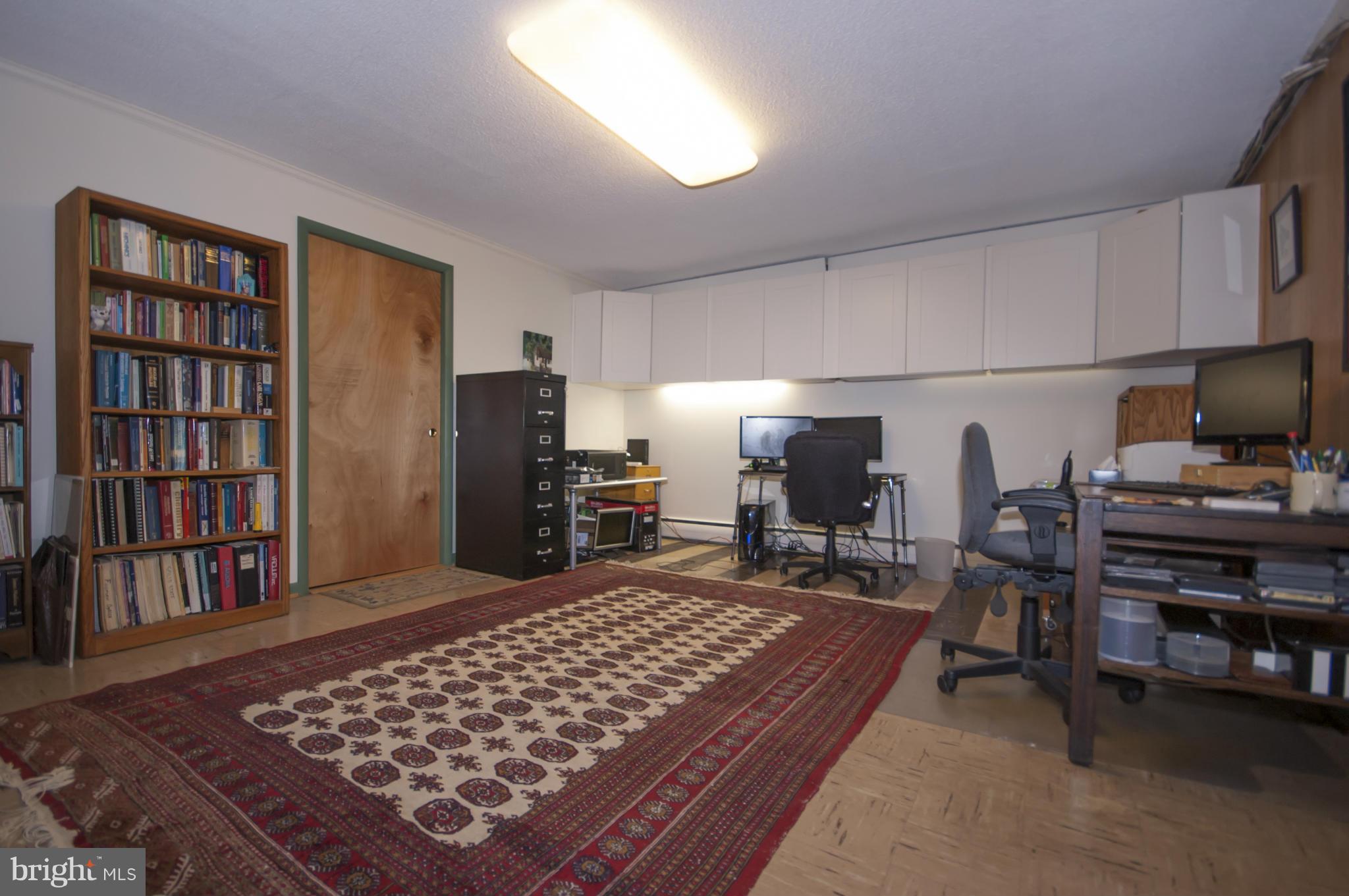 14612 Sturtevant Road Silver Spring, MD 20905 - Photo 18 of 22 a bed room with a bed and a television