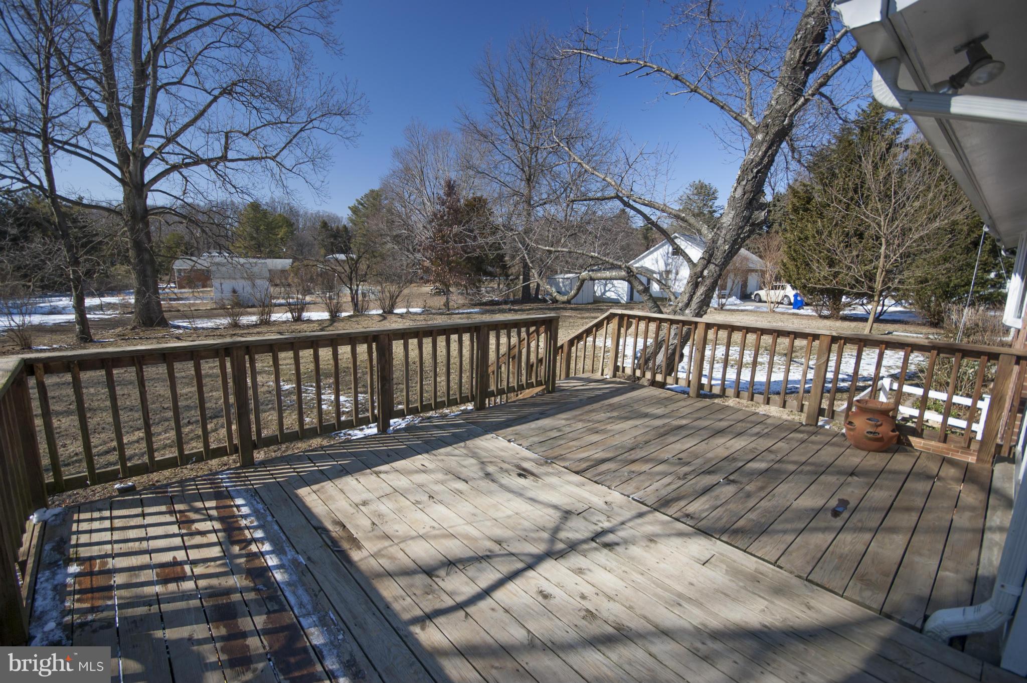 14612 Sturtevant Road Silver Spring, MD 20905 - Photo 20 of 22 a view of a wooden roof with trees