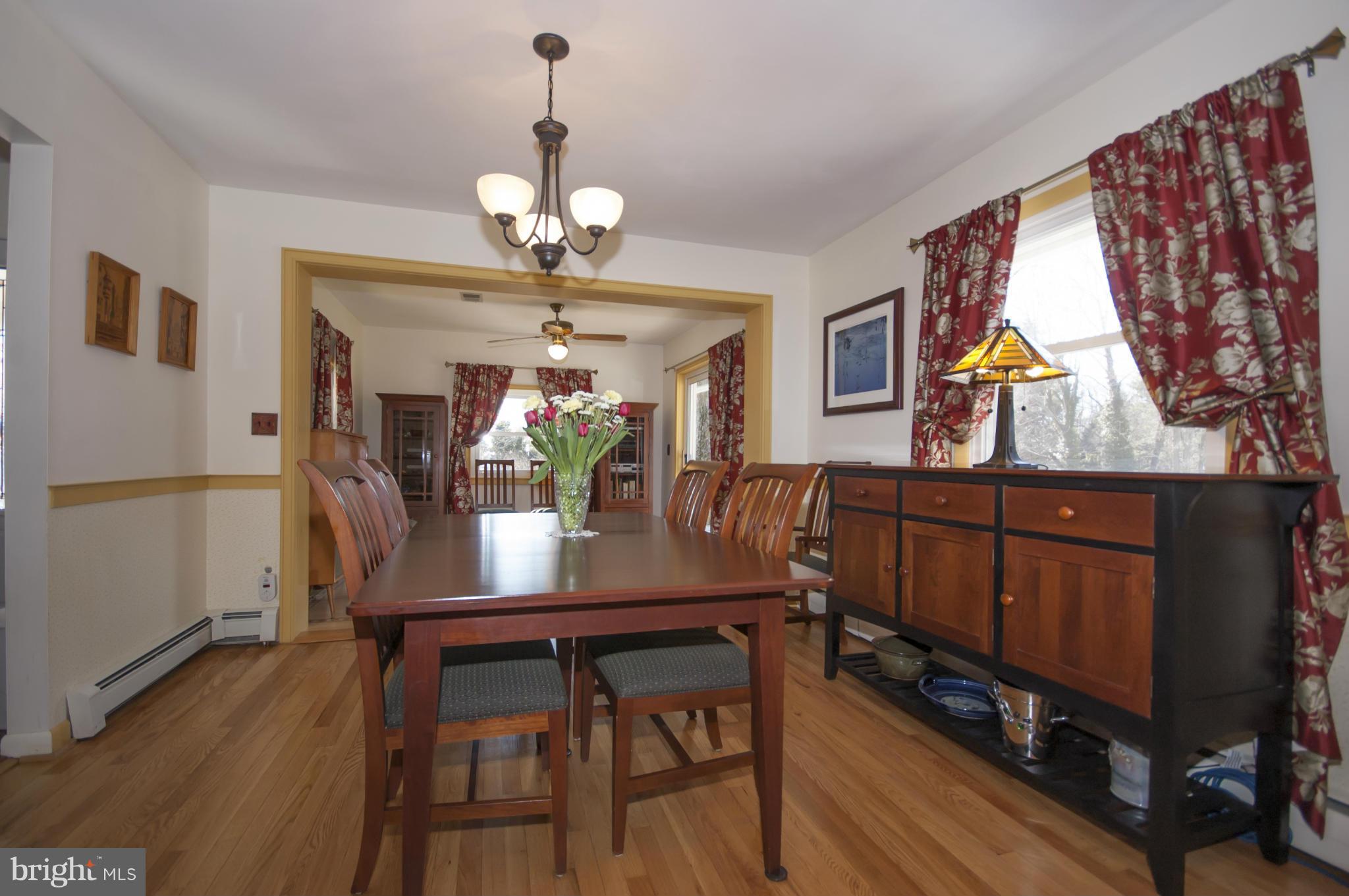14612 Sturtevant Road Silver Spring, MD 20905 - Photo 4 of 22 a view of a dining room with furniture and wooden floor