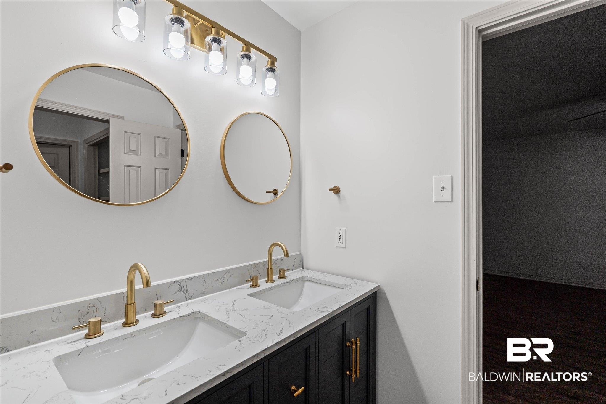 3655 Claridge Road South Mobile, AL 36608 - Photo 17 of 32 Bathroom with double vanity and wood finished floors