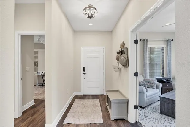 a kitchen with stainless steel appliances a sink stove refrigerator and cabinets