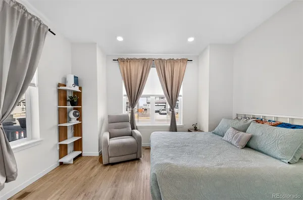 a bedroom with a bed and a couch