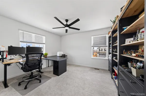 a view of a workspace with furniture