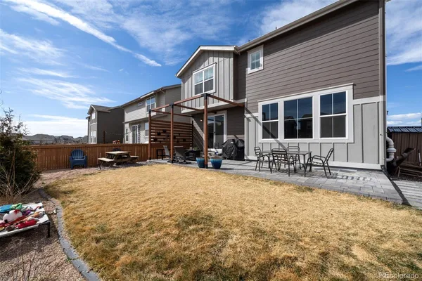 a view of a house with chairs in patio