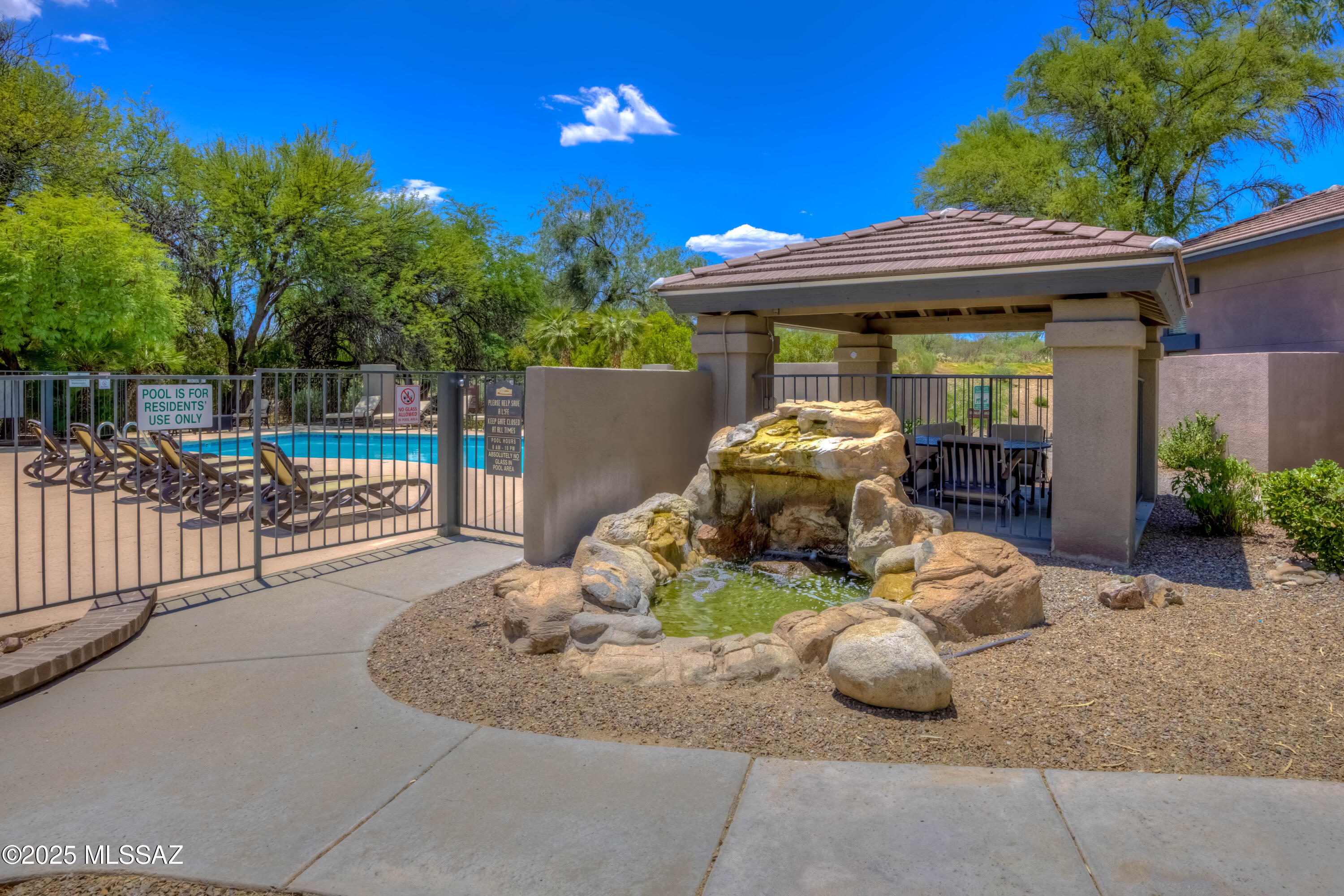 5855 North Kolb Road, Unit 8102 Tucson, AZ 85750 - Photo 26 of 28 a view of a chair and tables in the patio