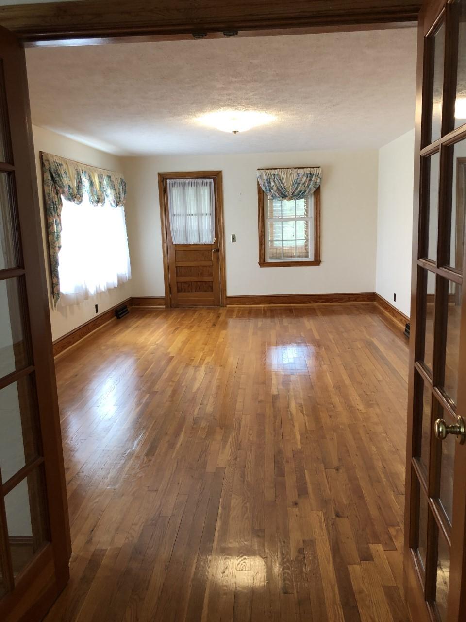 10091 Henry Road Henry, VA 24102 - Photo 19 of 40 wooden floor in an empty room with a window