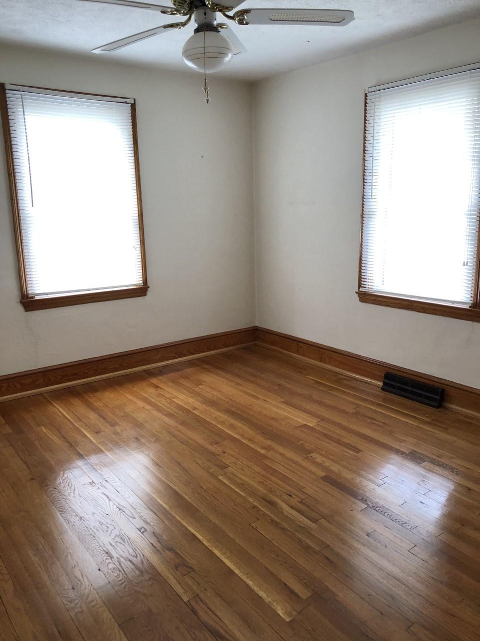 10091 Henry Road Henry, VA 24102 - Photo 20 of 40 an empty room with wooden floor and windows
