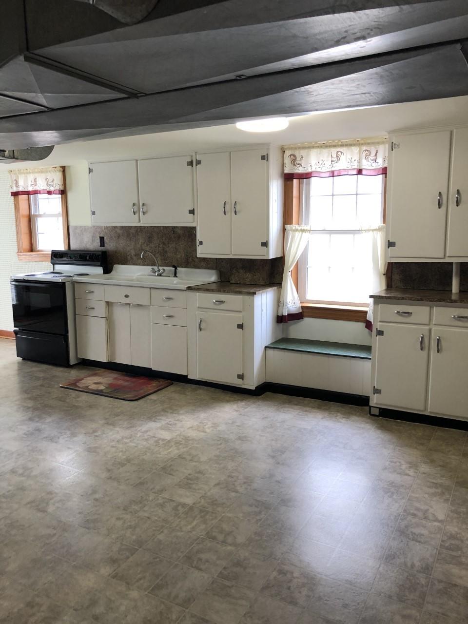 10091 Henry Road Henry, VA 24102 - Photo 30 of 40 a kitchen that has a sink and a stove