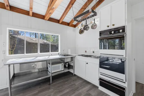 a kitchen with a stove and a sink