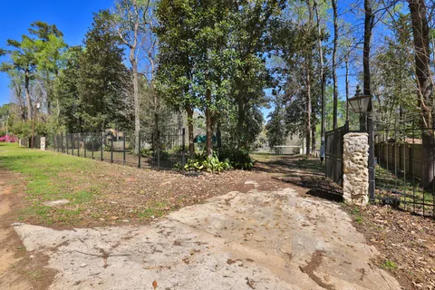 a street sign on a road next to a building
