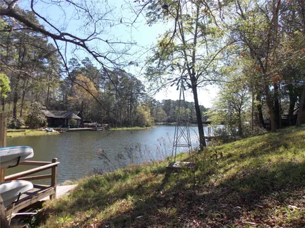 a view of a lake with trees by side of it