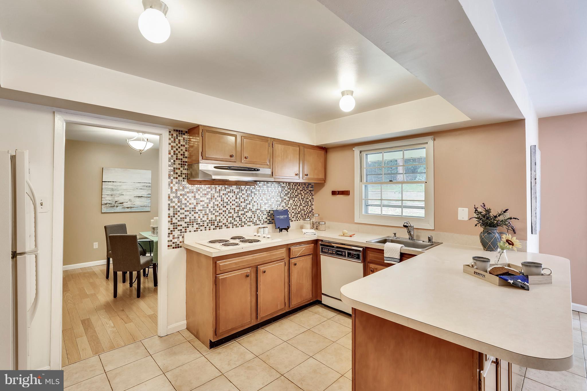 8902 Churchfield Lane Laurel, MD 20708 - Photo 12 of 30 Light filled w/ granite counters , tile floor