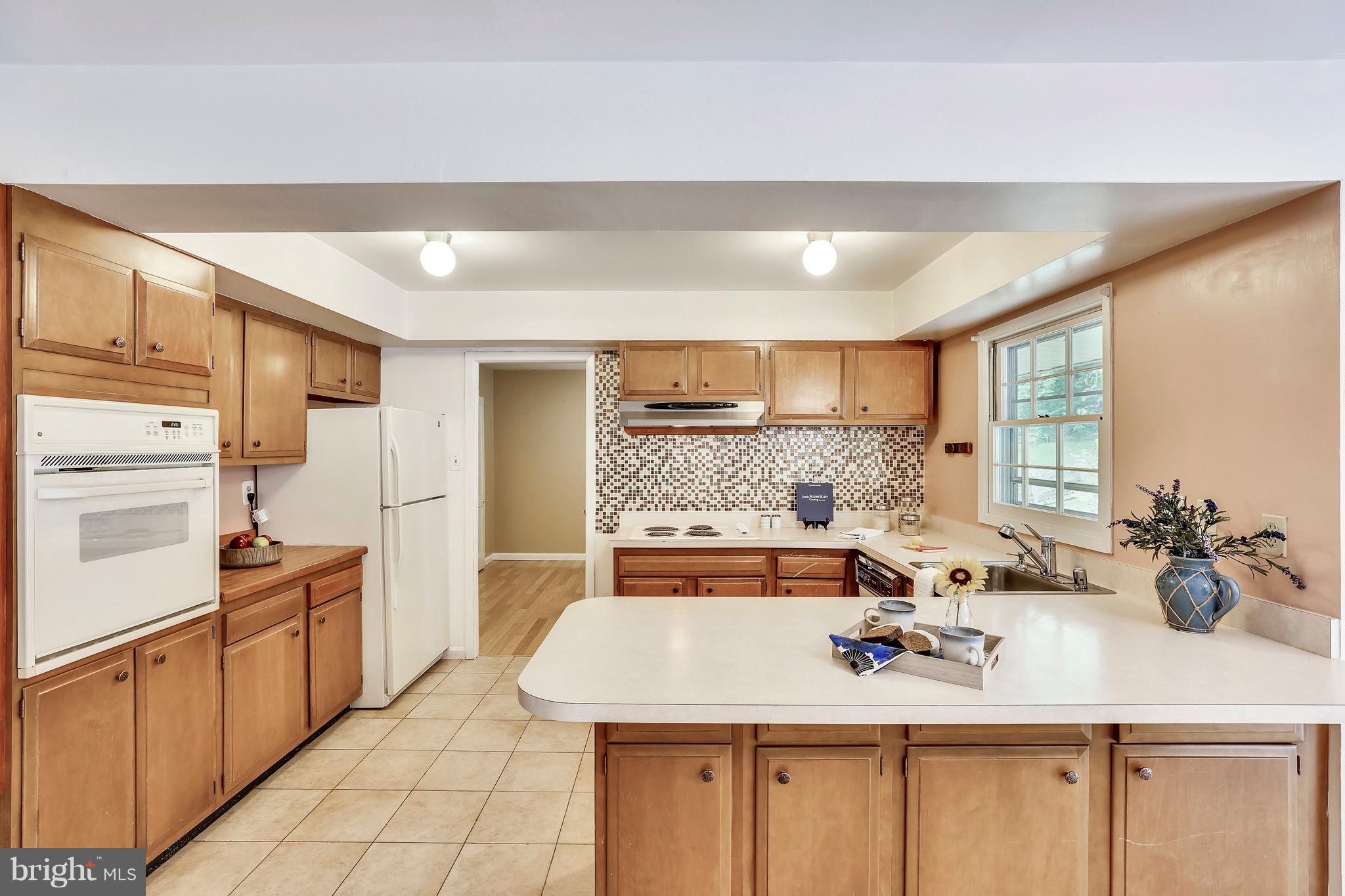 8902 Churchfield Lane Laurel, MD 20708 - Photo 4 of 30 Bright and cheery kitchen
