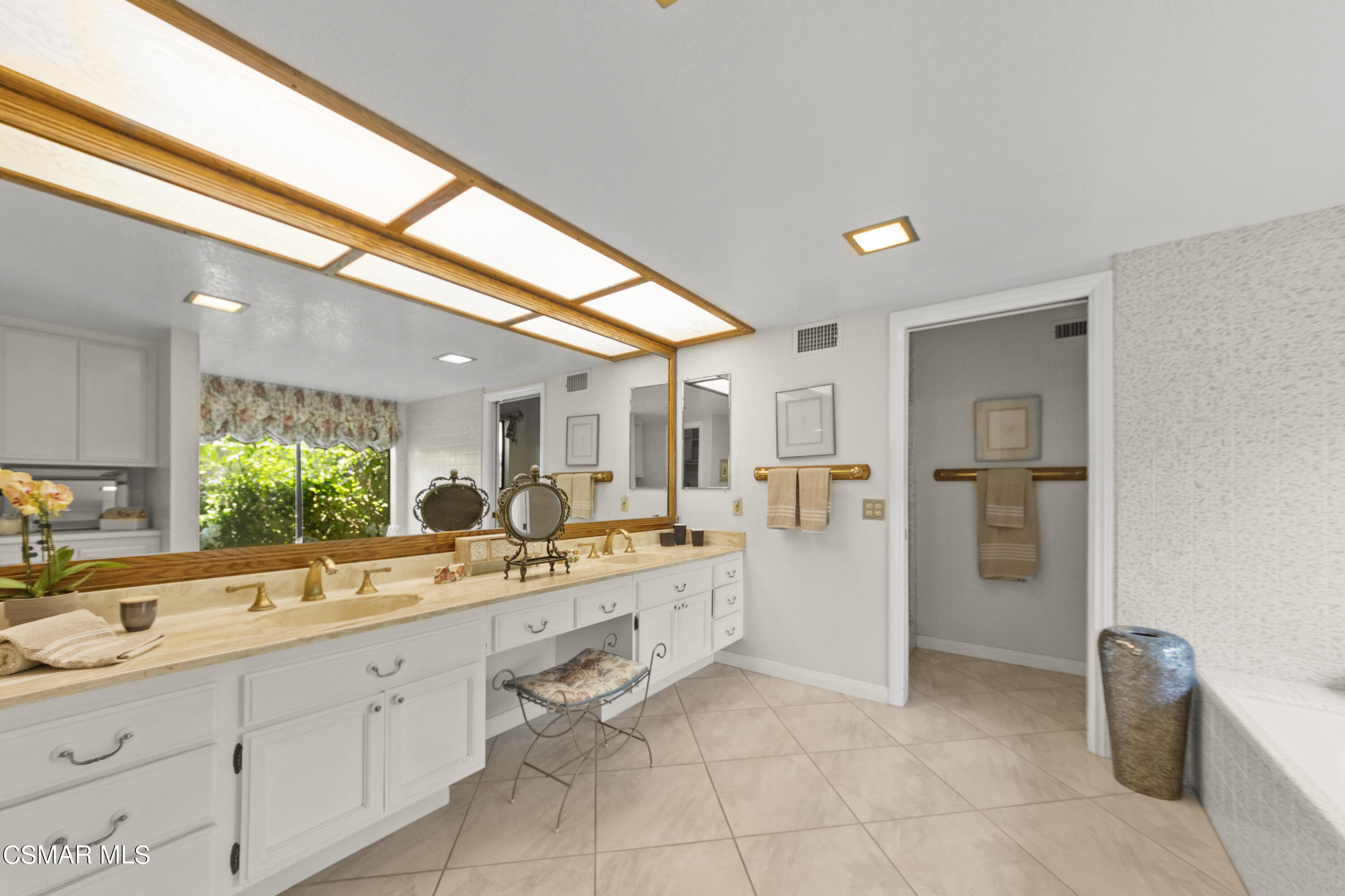 2774 Las Posas Circle Camarillo, CA 93012 - Photo 36 of 48 a large white kitchen with a sink and refrigerator