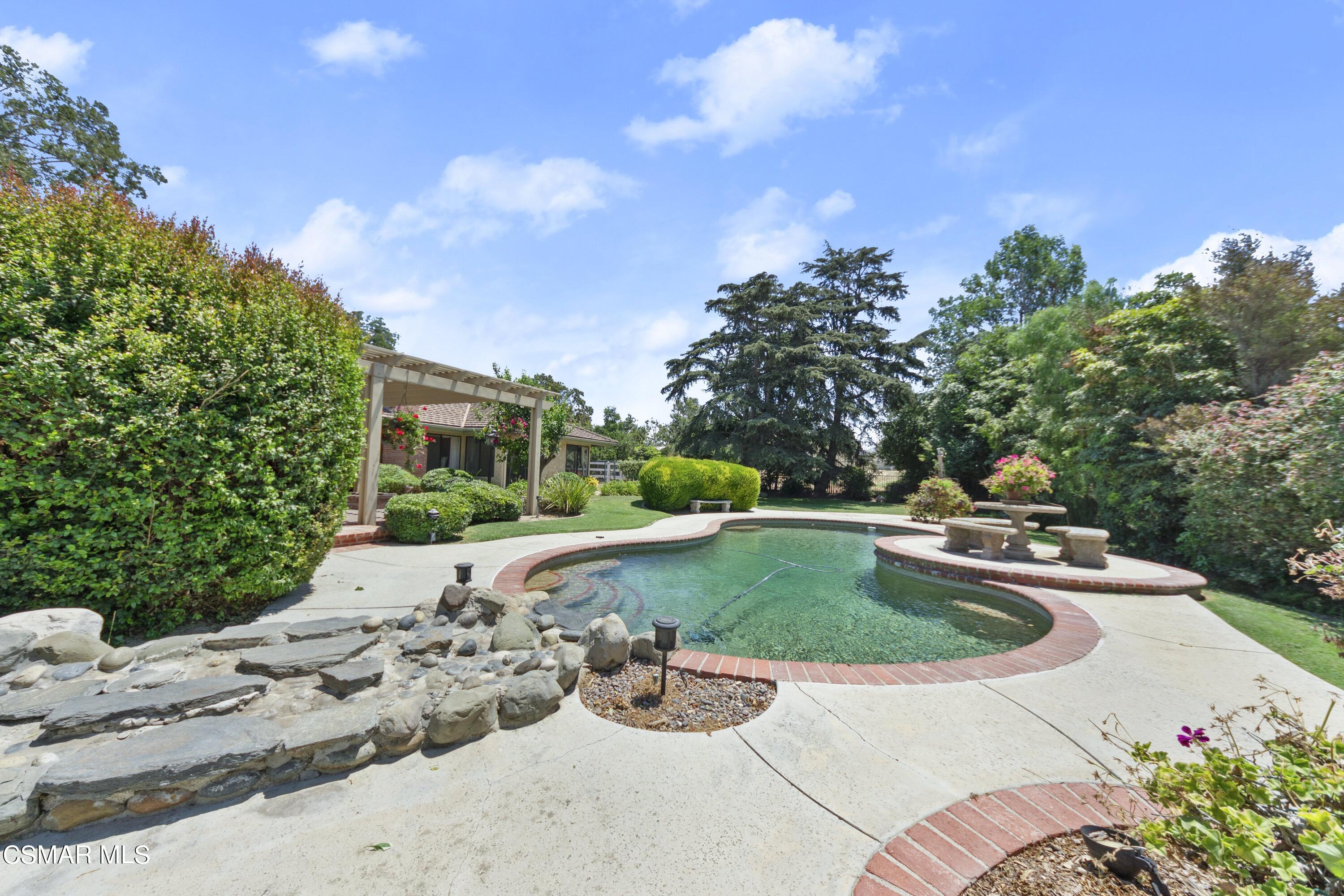 2774 Las Posas Circle Camarillo, CA 93012 - Photo 46 of 48 a view of a swimming pool with a yard
