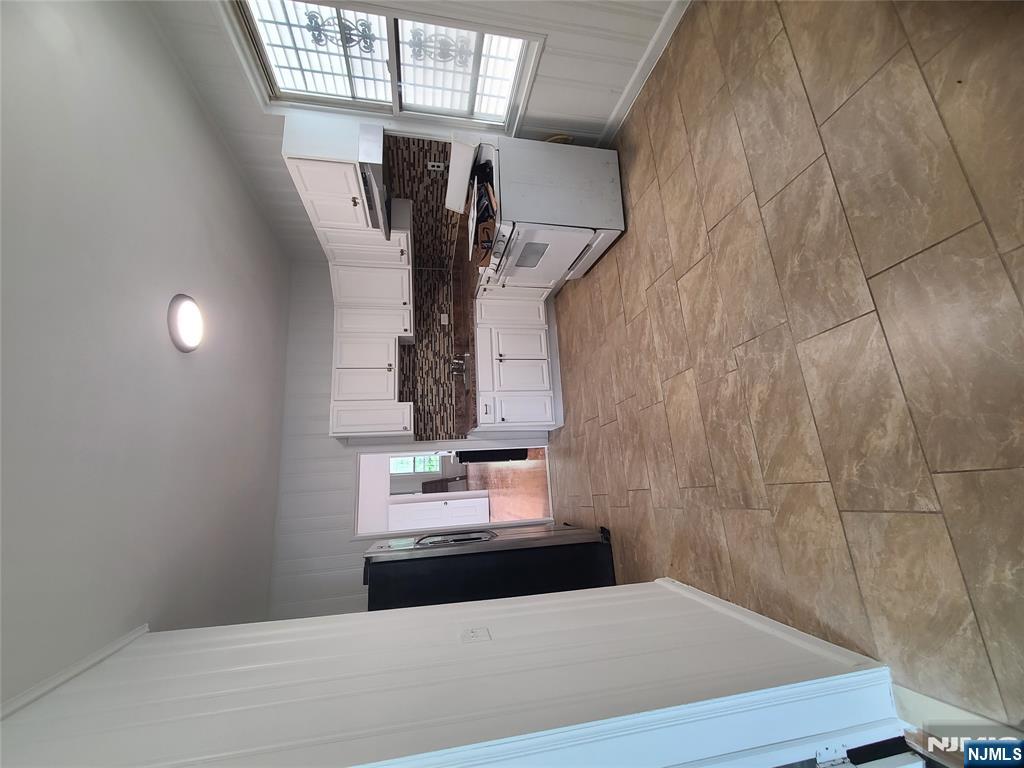 624 Madison Avenue Elizabeth, NJ 07201 - Photo 5 of 10 a kitchen with a refrigerator and a stove top oven