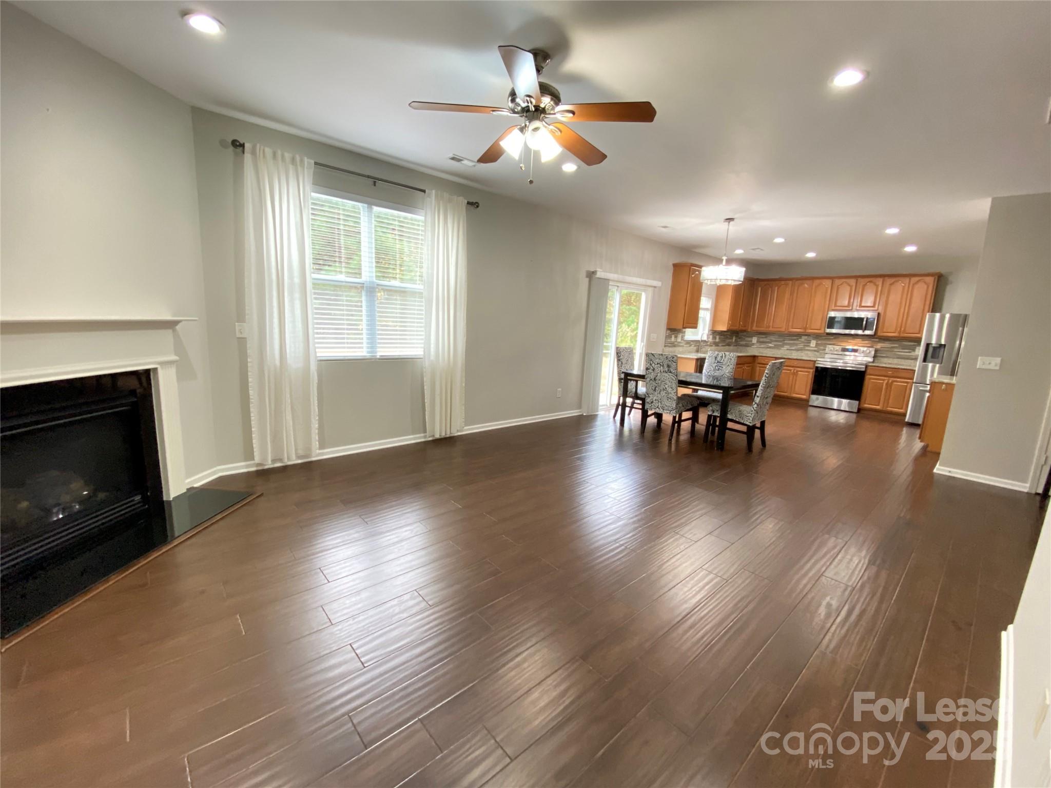 7306 Lamplighter Close Drive Matthews, NC 28105 - Photo 2 of 11 a view of a dining room with furniture window and wooden floor