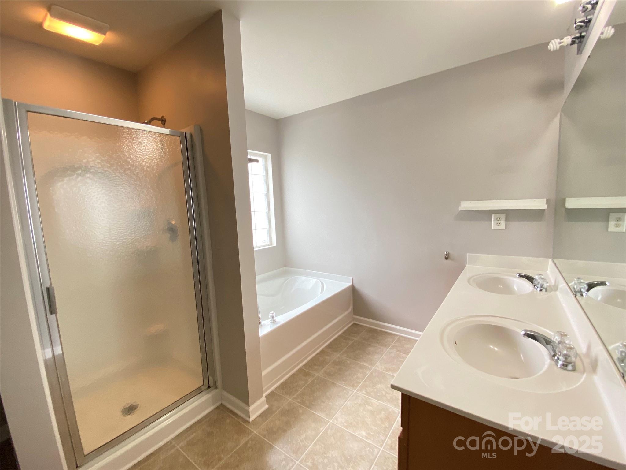 7306 Lamplighter Close Drive Matthews, NC 28105 - Photo 8 of 11 a bathroom with a sink and a tub