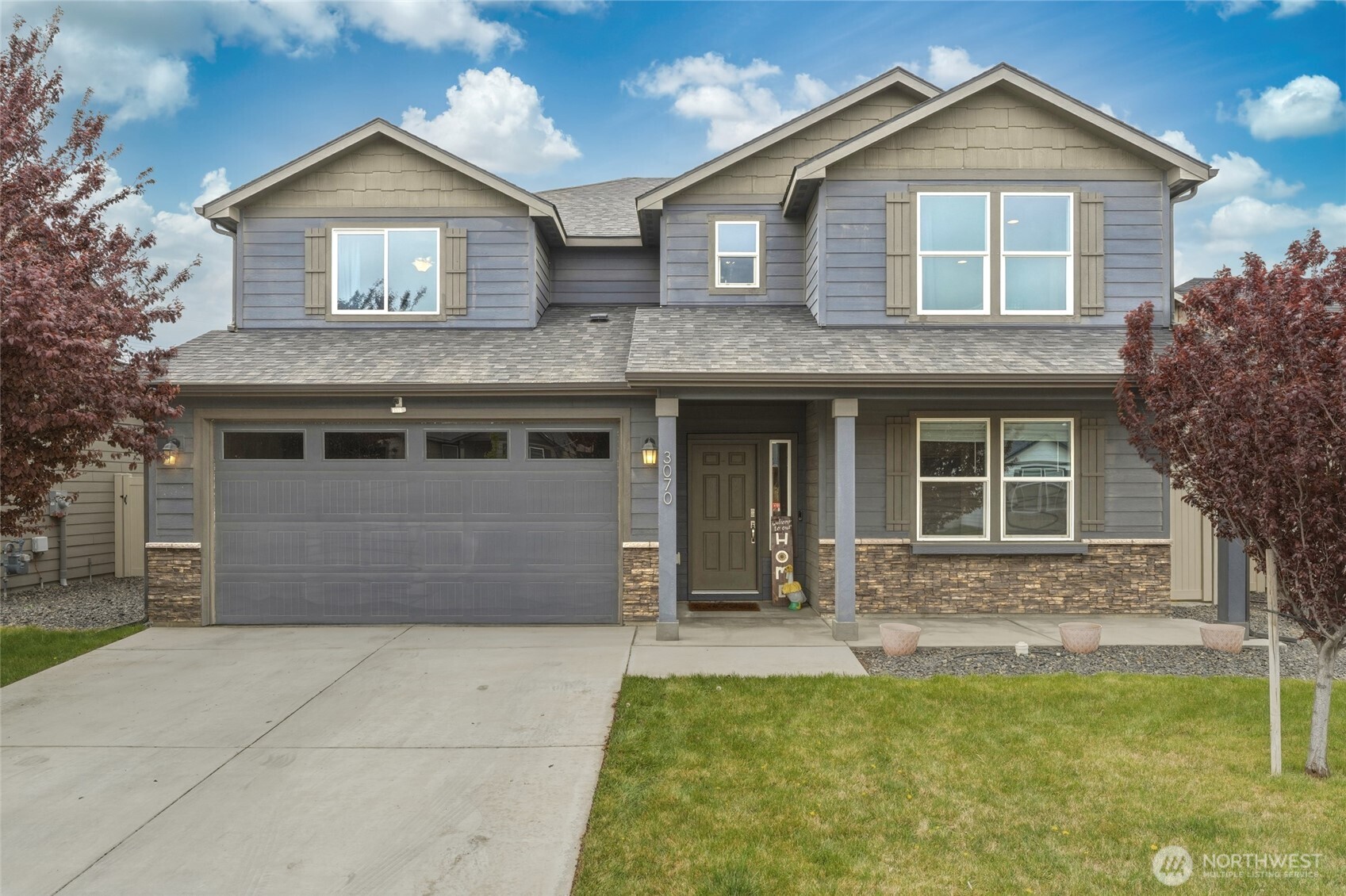 3070 Duval Loop Richland, WA 99352 - Photo 1 of 40 a front view of a house with garden