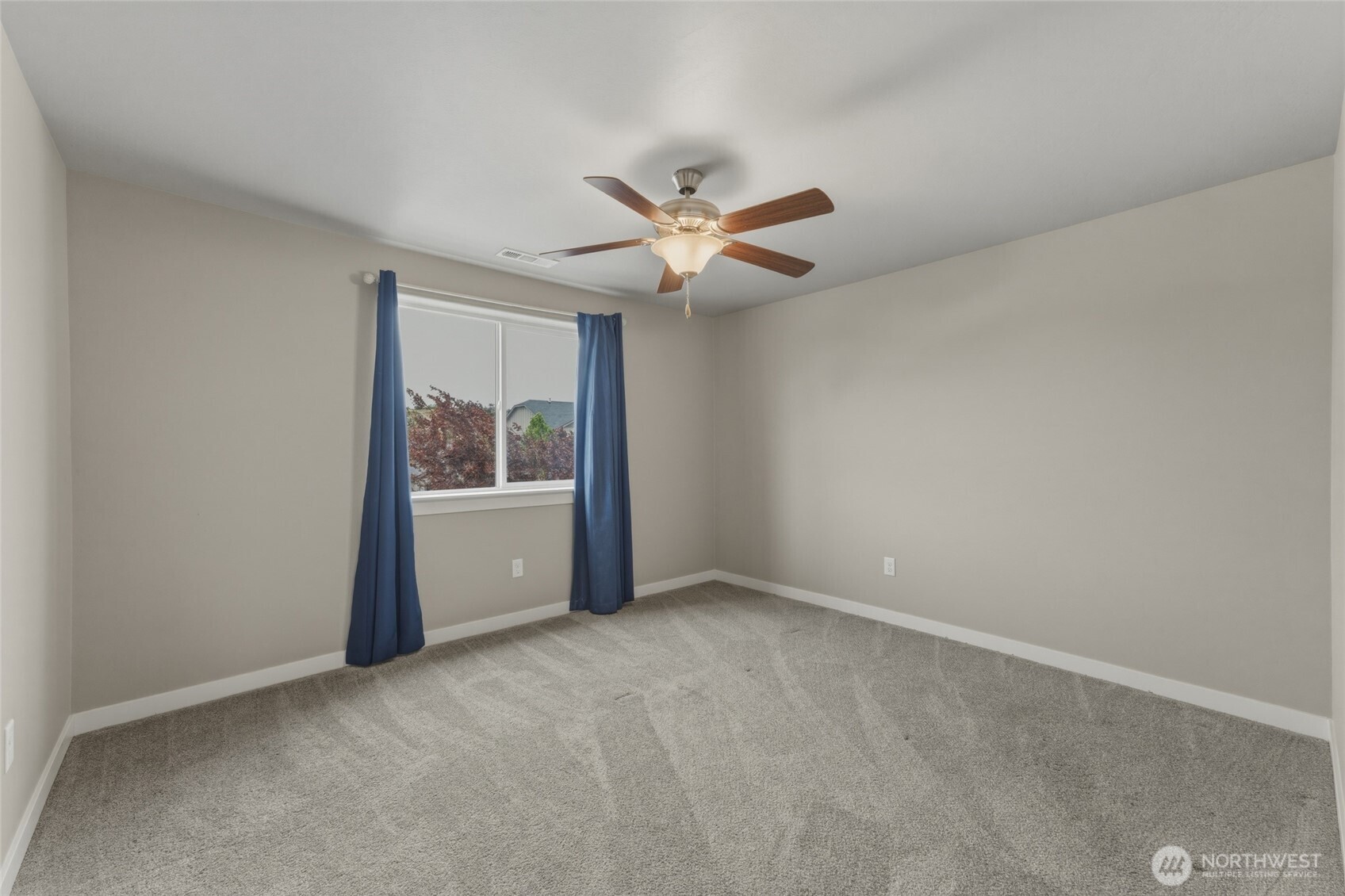 3070 Duval Loop Richland, WA 99352 - Photo 29 of 40 an empty room with fan and windows