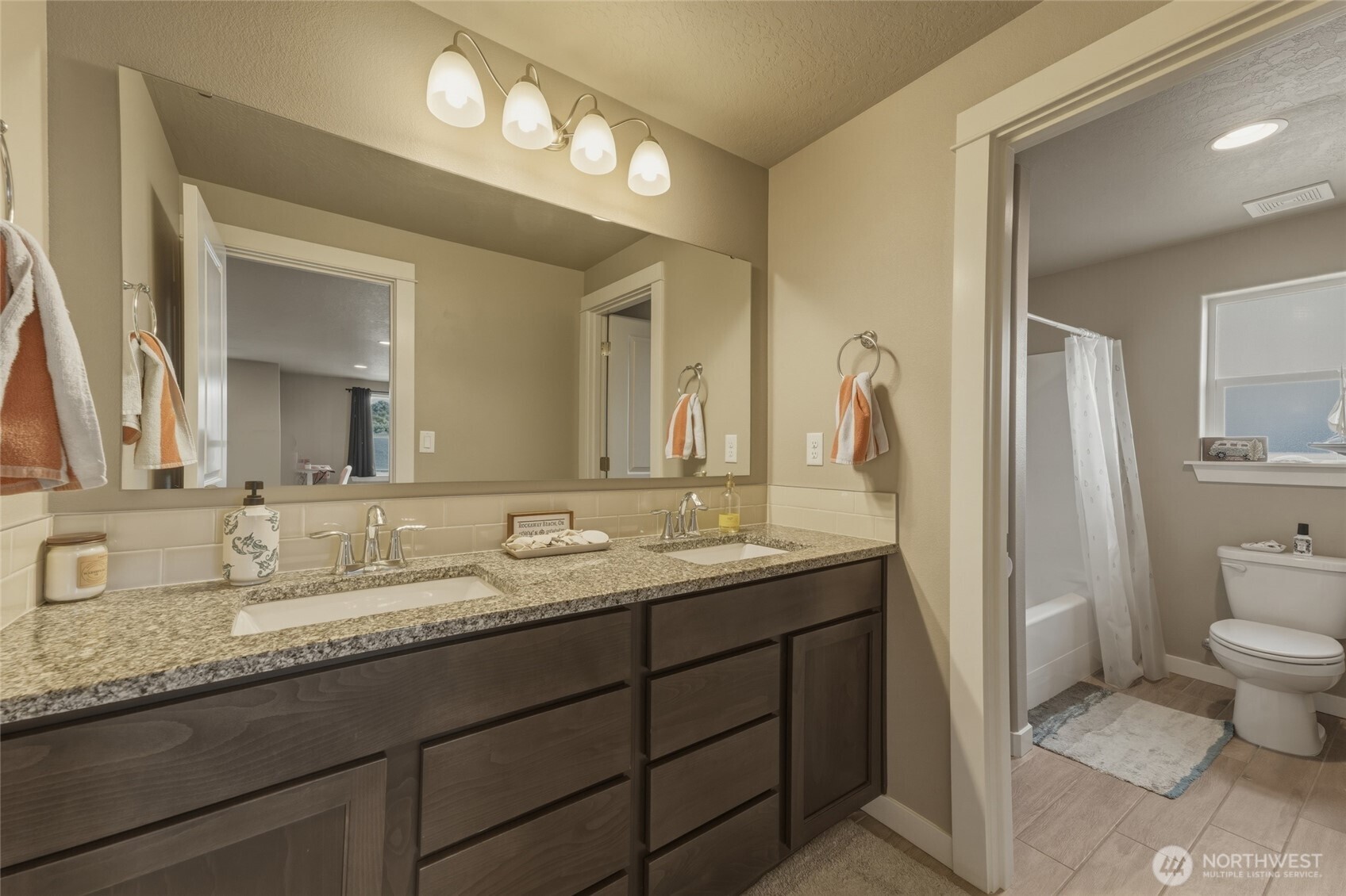 3070 Duval Loop Richland, WA 99352 - Photo 31 of 40 a bathroom with a granite countertop sink and a mirror