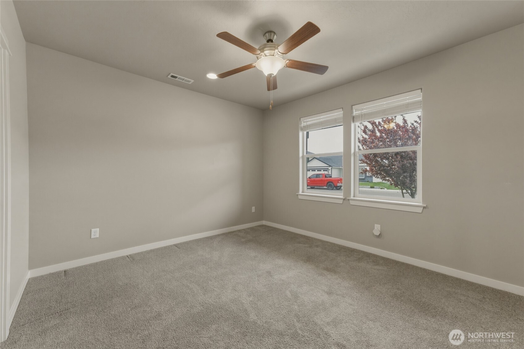 3070 Duval Loop Richland, WA 99352 - Photo 4 of 40 an empty room with ceiling fan and windows