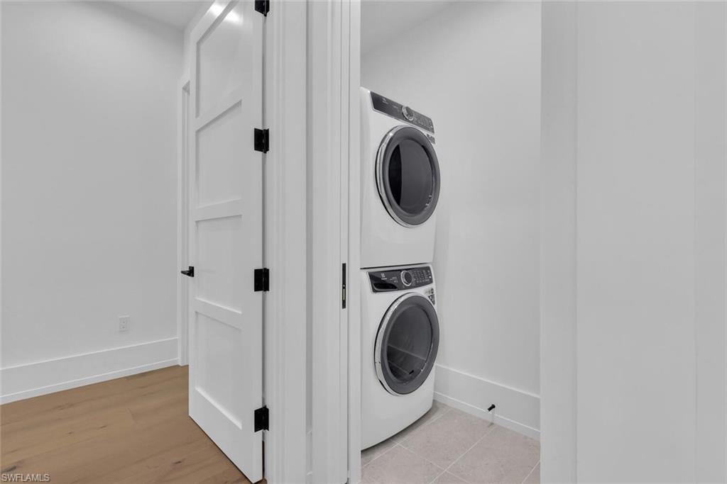 201 8th Street South, Unit 208 Naples, FL 34102 - Photo 26 of 46 a utility room with dryer and washer