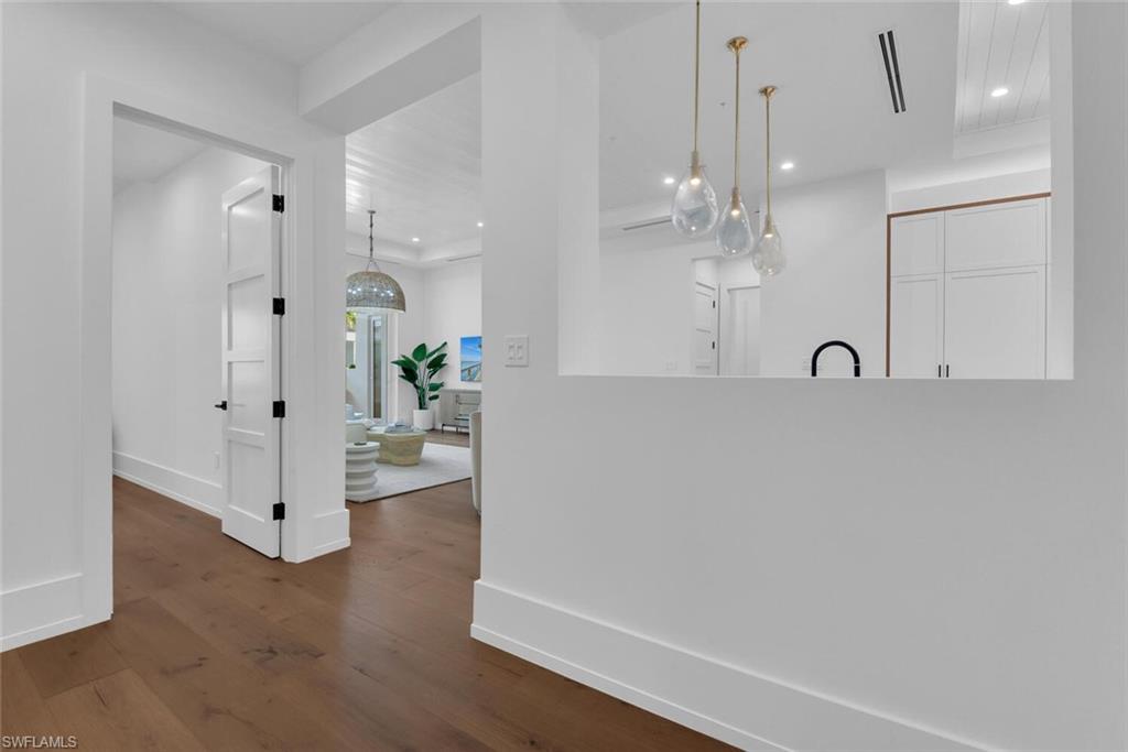 201 8th Street South, Unit 208 Naples, FL 34102 - Photo 3 of 46 a view of a livingroom with a chandelier