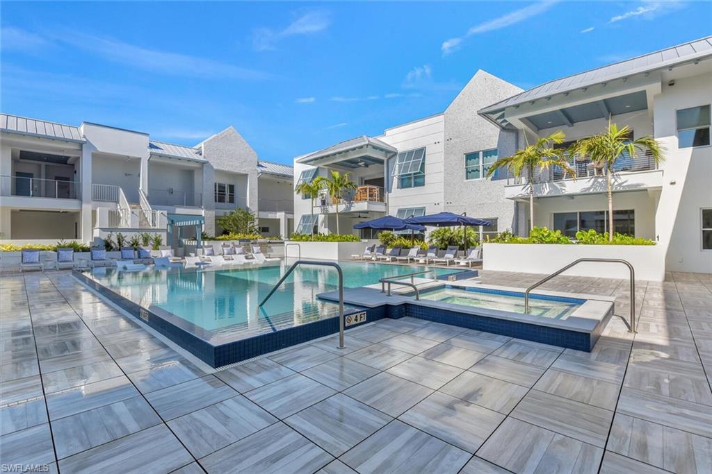 201 8th Street South, Unit 208 Naples, FL 34102 - Photo 30 of 46 a view of pool with outdoor seating